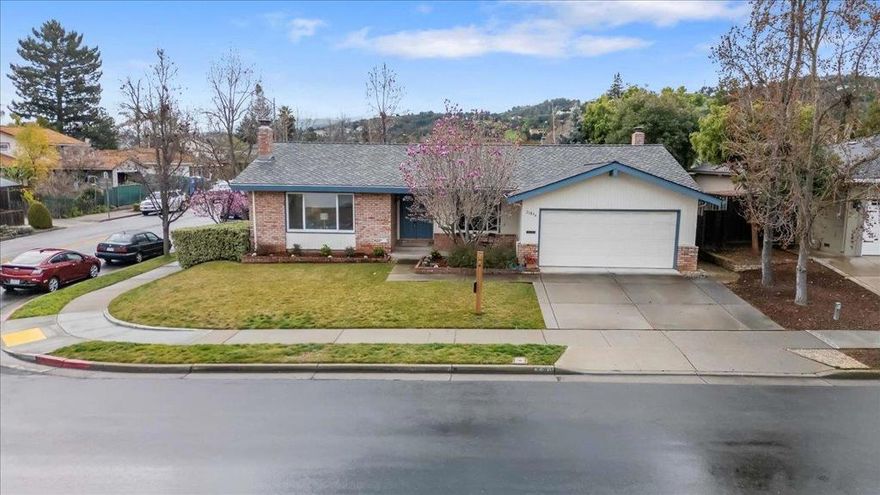 Nestled in a prime Cupertino neighborhood, this single-story corner-lot home offers 1,888 sq. ft. of refreshed living space on a 7,725 sq. ft. lot. With 3 bedrooms, 2 baths, and refinished hardwood floors, this home blends comfort and style. The sunken living room features tall windows and a floor-to-ceiling brick fireplace hearth, while the well-lit dining room overlooks a flowering magnolia tree. The open-concept kitchen and great room is designed for both function and flow. A chefs white porcelain split-style sink, Corian solid surface countertops, and a prep bar make cooking a breeze, while the dry bar with glass-doored cabinetry is ideal for morning coffee or evening cocktails. Equipped with GE, Jenn-Air, Bosch, and Maytag appliances, this space blends classic design with everyday convenience. great room includes new carpet, a fireplace flowing seamlessly to a decked backyard for alfresco living. The primary suite boasts backyard access, dual closets, and an updated ensuite bath. A spacious laundry room, two-car garage with storage, and lush landscaping with citrus trees complete this inviting home. Close to top-rated Cupertino schools: Monta Vista High, Kennedy Middle and Lincoln Elem, Apple Park, this home is an exceptional find!