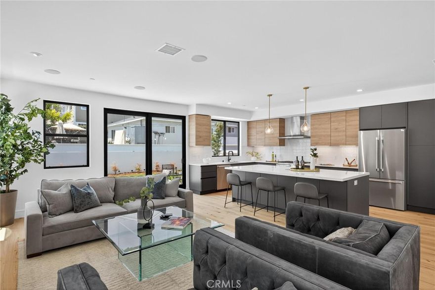 Price to good to be true!  This is an astonishing DEAL just in time for the holidays! Lovely, “Warm-Modern” Design, this newly constructed home was caringly designed with family and friends in mind. Located in a highly sought-after area of South Redondo Beach, less than 1 mile to Riviera Village and the Redondo Beach coast.  This exceptional home with it’s spacious 3,326 sq. ft. in the main house, features a desirable floorplan with 1 ground level bedroom and private bath, plus 3 more bedrooms and 2 bathrooms upstairs. Additionally, enjoy a completely separate, 550 sq. ft. 1 bed/ 1 bath ADU with kitchen and laundry; perfect for live-in help or extended family needs, making a total of 3,875 sq. ft. The main house features premium Italian cabinetry by AR-Due, Thermador appliances with dual fuel range, quartz counter tops, European Oak flooring and custom closet systems by Maronese ACF, known for their craftsmanship and design.  Enjoy the benefits of new construction, including battery ready Solar systems and tankless water heaters on both the main house and the ADU, all separately metered.  Quality craftsmanship from top to bottom, this home is a treasure to be discovered by a very lucky family.  This one checks all of the boxes!