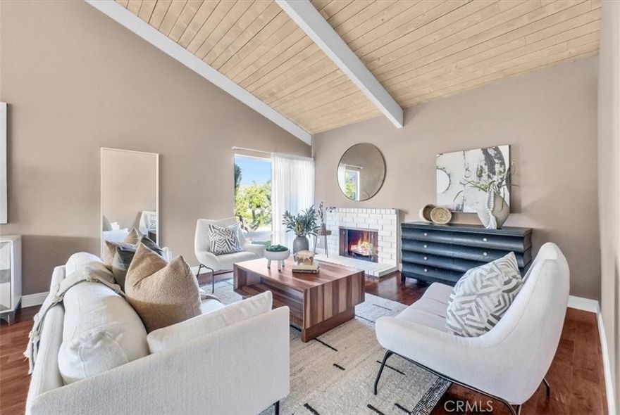 31358 Flying Cloud is an Attached single level two bedroom two bath SFR in the heart of the Midcentury-inspired marvel called Pacific Island Village – a planned community located on the Pacific Island Hilltop above Monarch Beach and the coastline resorts – approximately one mile from the beach.  The home has interior remodeling yet retains much of the original Midcentury feel including original Midcentury style open beamed ceilings, 60’s style wood burning fireplace, and original bathrooms and kitchen.  Wood Flooring. Double door entry. No stairs anywhere inside the property. Mirrored wardrobes.   Newer Roof. Newer windows.  Front Lawn. And close to a two car detached garage only a few steps away from the front door.

Partial view of Capo Valley and City Lights from kitchen and rear bedroom.  Mission Bells in the morning. Nearby coastal ridge hiking trails. 

Great potential in a Five Star Hilltop Location!  The property is ideally located on a corner site, near the community pool and clubhouse, on the street level.

The Pacific Island Hilltop provides casual living high above the resorts, and close proximity to everything everyone loves about the Laguna Beach/ Dana Point Resort Areas. No age restrictions in Pacific Island Village/ Planned Community with No mello roos and low property tax rate.