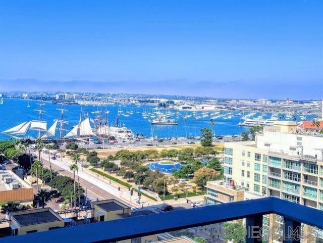 Coveted South West corner residence at Savina, San Diego’s luxury condominium, is all about the VIEWS. Dramatic urban landscapes, city lights, Star of India, sunsets, and beautiful bay views. Mornings on the spacious balcony welcome the day, while evenings showcase the city's illumination. This two bedroom/two baths unit has one of the best floorplans, open and bright. Primary is spacious with walk-in closet, spa like bath. Kitchen is modern with a large waterfall island and hardwood floors run throughout. Included is a storage unit and parking for two vehicles with dedicated EV charger. Savina is renowned for its extensive amenities, including 24-Hr security, a resort-style pool with cabanas, a grand social lounge, BBQ stations, a state-of-the-art gym, steam and sauna rooms, a yoga terrace, a business center, a pet retreat and grooming center, bicycle storage and workshop, EV charging stations, and various cool social areas. Google Webpass is included in the HOA fees. Savina offers proximity to all that downtown San Diego has to offer: the waterfront, Little Italy, the airport, trains, trolleys, farmer’s markets, fine dining, bars, coffee shops, and a wide array of entertainment venues. Savina is downtown living at its finest!
