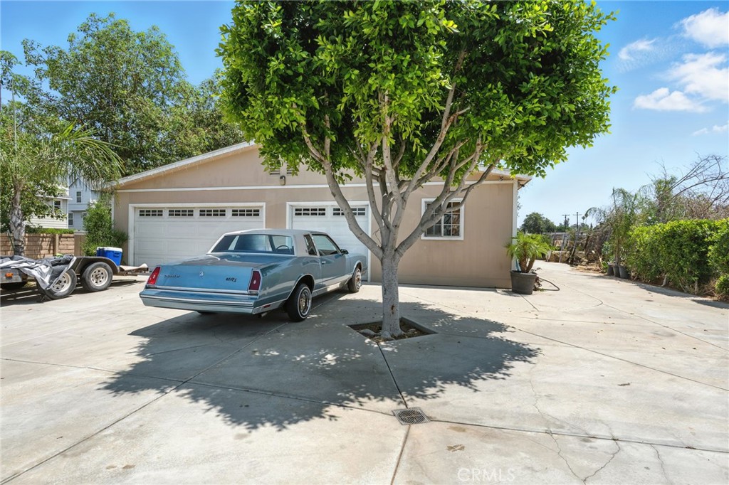 Discover this beautifully maintained single-story gem nestled in the heart of Riverside’s highly sought-after La Sierra neighborhood. Offering over 3,040 sq ft of versatile living space, this expansive 4-bedroom, 3-bathroom home is ideal for large or multigenerational families, remote professionals, or savvy investors looking for potential rental income. Step inside to an inviting open-concept layout designed with both comfort and entertaining in mind. The sunlit living and dining areas seamlessly flow into a modern kitchen featuring sleek countertops, ample cabinetry, and updated appliances — a dream for any home chef. Large windows throughout bathe the home in natural light, creating a warm, welcoming atmosphere. Each of the generously sized bedrooms offers privacy and tranquility, while the primary suite serves as a true retreat with a bonus sitting area, large walk-in closet, and a luxurious en-suite featuring a soaking tub and separate shower. Outside, enjoy peace of mind with a gated entrance, an oversized 3-car garage, and a spacious driveway for additional parking. The low-maintenance backyard is ideal for outdoor gatherings, gardening, or simply relaxing under the covered patio, surrounded by mature fruit trees and a convenient storage shed. Just minutes away from Riverside Art Museum, Fox Performing Arts Center, and Downtown Riverside’s Mission Inn District. Go shopping at the Galleria at Tyler and Arlington Heights. Enjoy the active life at La Sierra Park, Santa Ana River Trail, Hidden Valley Wildlife Area and Mount Rubidoux. Commuter friendly access to 91 Freeway and Metrolink Station.