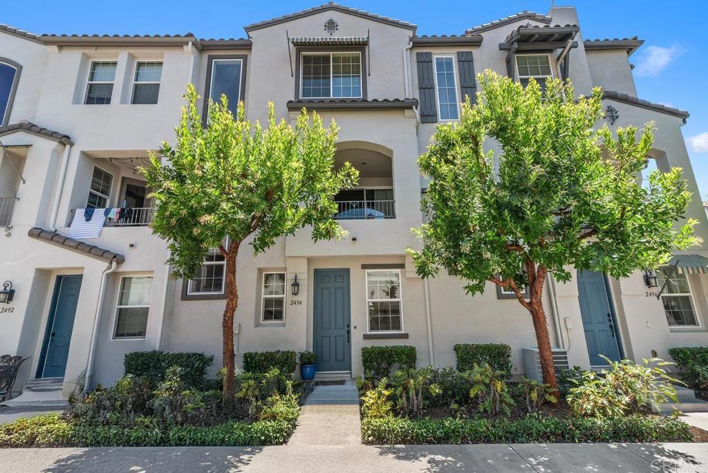 Located on the border of San Marcos & Carlsbad, this beautifully maintained three-story condo offers 1,419 square feet of modern living space, including three bedrooms, two and a half bathrooms, and a flexible bonus room on the entry level—ideal for a home office, gym, or guest space. The main living level features stunning laminate flooring with a warm, wood-look finish that complements the open-concept design. At the heart of the home is a spacious, upgraded kitchen with sleek cabinetry, generous counter space, newer appliances, and a large center island with bar seating. The kitchen flows seamlessly into the dining and living areas, with access to a private balcony—perfect for enjoying morning coffee or relaxing at the end of the day. Upstairs, you’ll find three well-appointed bedrooms with upgraded premium carpet, a comfortable primary suite, as well as an upstairs laundry area for added convenience. The home features an attached two-car garage with additional storage space. Not just a home, this lovely neighborhood is a true community where you can enjoy resort-style amenities including a pool, spa, BBQ area, firepit, and park-like green spaces. With easy access to major freeways, top-rated schools, shopping, and just a short drive to several beaches, this home offers comfort, convenience, and exceptional value in one of North County’s most desirable neighborhoods.
