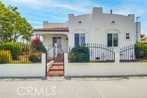 Charming and updated, this 2 bedroom, 1 bath Spanish-style home, sits on a desirable corner lot in the heart of National City. Originally built in 1935, the home has been tastefully remodeled to blend classic character with modern convenience. Inside, you'll find hardwood and tile flooring throughout, a cozy fireplace, fresh paint, and energy-efficient dual-pane windows that fill the space with natural light. The beautifully updated kitchen features granite countertops, stainless steel appliances, and newer cabinetry--ideal for both everyday living and entertaining. One of the standout features is the converted garage, now a private studio with its own bathroom, perfect for guests, rental income, or a home office. The property offers low-maintenance irrigated outdoor space and is conveniently located near shopping, dining, schools, and quick freeway access. Just a short drive to Downtown San Diego, this move-in-ready home is a rare blend of vintage charm and functional upgrades.