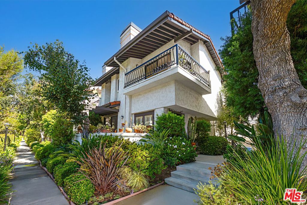 MUST SEE IN PERSON TO APPRECIATE THE SIZE AND OPEN FLOOR PLAN OF ONE OF THE LARGEST TOWNHOMES IN THE PACIFIC PALISADES HIGHLANDS! With unobstructed mountain and canyon views, and an abundance of natural light, not only does this end unit feel like a single-family residence, it's also an incredible value at $622 per square foot. Upon entering, there is a spacious living room which includes a fireplace and vaulted ceilings. Adjacent to the living room is a large patio with plenty of room for a barbeque and outdoor furniture. This home also has a separate dining area, wet bar, guest bathroom, and chef's kitchen with its own sitting area which is perfect for relaxing and entertaining. This portion of the unit has been remodeled and redesigned with an open concept and includes hardwood floors w/upgraded baseboards, solid doors with new hardware and trim, custom cabinetry, granite countertops, stainless steel appliances (w/dual ovens and dual dishwashers), custom/LED lighting, a small custom elevator which can be used to carry groceries directly to the kitchen from the garage, and surround sound speakers which are pre-wired in the sitting area. All three bedrooms are upstairs and include a spacious primary with a fireplace, wrap around balcony with mountain/canyon views, vaulted ceilings, a walk-in and additional closet, an en-suite bathroom with dual sinks, a bathtub and a remodeled shower. The second bedroom includes a walk-in closet and shares a bathroom with the third bedroom. Additional features on the upper level include new carpeting, upgraded solid doors and hardware, trim, and baseboards, as well as a wonderful skylight. On the ground floor there is direct access to a two car garage, washer and dryer, an upgraded HVAC system, a recently replaced water heater, and an adjacent bonus/storage room. In addition to 24-hour security patrol, the HOA is surrounded by lush and mature landscaping and includes a swimming pool and spa, dry saunas, and a fitness room. FURNISHED PHOTOS ARE VIRTUALLY STAGED.