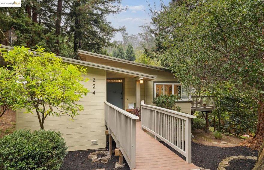 Mid-century charm and rare level-in living in Montclair! Cozy, light-filled cottage with vaulted ceilings and an open-concept main living space with great morning sun. The kitchen’s custom wood cabinetry adds warmth and craftsmanship, while glass doors off the living area open to a spacious deck overlooking a private, level patio, perfect for morning coffee and yoga, or entertaining and stargazing by night. With three bedrooms, two baths, and laundry area, the home lives comfortably on a single level. The generous double parcel offers opportunity: grow your own garden, create a studio or ADU, or add a future addition to the house, buyer to verify. Easy access partial basement with space for workshop and storage! Located just around the corner from Thornhill’s beloved shops and cafes, and just minutes to Montclair Village with Sunday Farmer’s Market, this is a rare retreat in the heart of one of Oakland’s great neighborhoods.