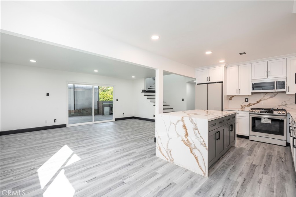 Located in a peaceful Mission Hills cul-de-sac in the heart of the San Fernando Valley, 10864 Wolcott Place offers 6 bedrooms, 2 bathrooms, and approximately 2,036 square feet of living space on a generous 7,500+ square foot lot. Ideal for multi-generational living or a large household, this well-maintained residence features a bright and functional layout, including a spacious living room, formal dining area, and a kitchen with ample cabinet space. The expansive backyard is ideal for outdoor entertaining, gardening, or relaxing in peace and privacy. Additional highlights include an attached 2-car garage, two separate driveways providing ample off-street parking, and easy access for potential ADU use. Conveniently located near the 5, 118, and 405 freeways, as well as schools, parks, and shopping centers, this home offers comfort, space, and excellent accessibility in a desirable San Fernando Valley neighborhood.