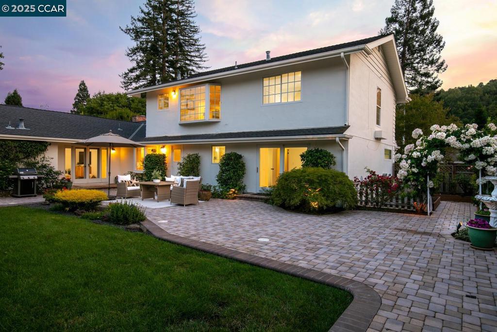 Spacious and versatile 5BR/3BA, 3,051 sq. ft. home on a beautifully landscaped 0.26-acre lot in one of Moraga’s best neighborhoods. This well maintained home features two en suite bedrooms—one on the main level. Dedicated office (5th BR) with built-ins and dual workstations. Enjoy a light-filled living room with a floor-to-ceiling window, formal dining, cozy family room with french doors, and a plus sized laundry/craft room. The eat-in kitchen has double ovens, 4-burner cooktop, and pantry. Large bedrooms, and the expansive 700+ sq. ft. primary suite offers a beautiful light-filled bathroom, with new soaking tub, double sink vanity, dual closets, and an additional walk-in. Elegant original dark stained hardwood flooring throughout the downstairs adds. Outside, find a lush central backyard, with paver patio, arbored entrance to garden with raised beds, mature roses, and a professionally designed, drought tolerant front yard. Garage includes multiple storage cabinets with a workbench, and EV charger. Hop, skip, and a jump to top-rated schools, parks, trails, and Moraga Shopping Center with a year round farmer’s market. A rare blend of space, style, and location!