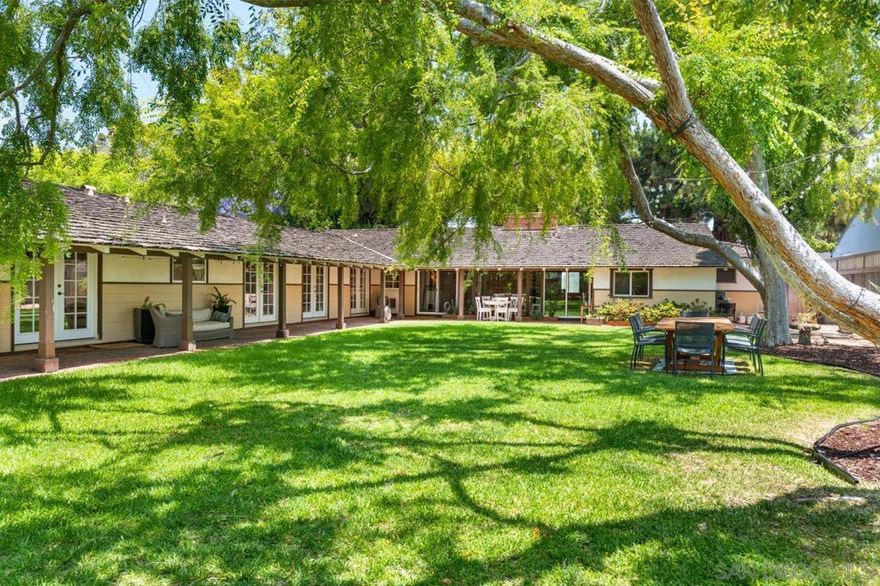 Experience the charm of laid-back living in this inviting one-story ranch-style rental on the peaceful Margarita Avenue in Coronado. Spanning a generous 3,012 square feet, this home is designed with relaxation and functionality in mind, offering a warm and welcoming atmosphere in a 10,600 sqft lot.  Featuring four spacious bedrooms and three and a half bathrooms, this home is perfect for families seeking comfort and space. The additional maid quarters provide flexibility for guests or extended family living arrangements.  All rooms are designed to embrace the outdoors, each facing and providing access to the gorgeous yard. This expansive outdoor space, dotted with stately old trees, is perfect for great outdoor gatherings. Imagine entertaining under a canopy of string lights, surrounded by nature, creating an enchanting ambiance for any occasion. Embrace the unassuming elegance of this home where laid-back living meets practicality, offering a serene retreat in one of Coronado's most desirable neighborhoods.