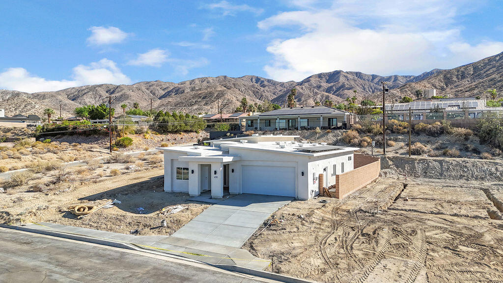 A stunning brand new home four bedrooms, two and a half bath residence perched near the top of the mountain offering views of the San Jacinto mountains. This home combines uniqueness and comfort, with modern amenities and a serene setting.