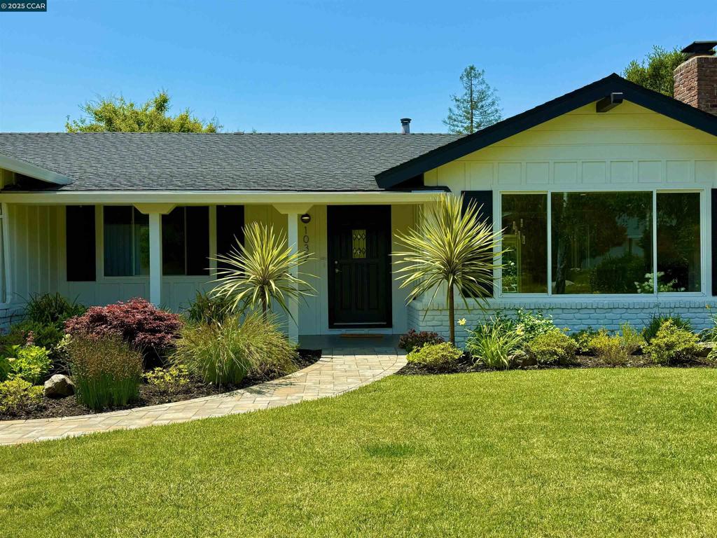Nestled in one of Moraga’s most desirable neighborhoods, this remodeled single-level home blends comfort, charm, and convenience. Featuring 3 bedrooms and 2 bathrooms, including a primary suite with an en suite bath, this home is designed for easy living and effortless entertaining. Step into a light-filled living space with hardwood floors throughout, recessed lighting in the living room and hallway, and a functional, flowing floor plan. The updated kitchen boasts sleek Corian countertops and offers a seamless connection to the dining and living areas. Two of the bedrooms open directly to the enchanting backyard through glass sliders, where a manicured lawn, a majestic Japanese maple, and a vibrant row of roses frame serene views of the hills. Whether you're soaking up the sun or relaxing in the shade, this private outdoor space is pure magic. Enjoy close proximity to Moraga’s favorite amenities—top-rated schools, a weekly farmers’ market, the country club, grocery stores, restaurants, and more—all just moments away. With its charming curb appeal, inviting front lawn, and thoughtful updates throughout, 1032 Sanders Drive offers the ideal blend of indoor-outdoor California living.