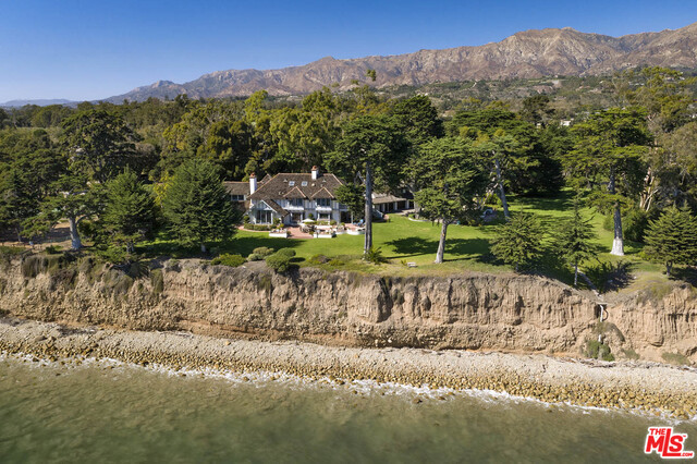 The California coast is home to many millionaires, movie stars, and moguls but few have a playground as posh as 3055 Padaro Lane. Spanning over 4.3 acres on 2 parcels, this oceanfront estate spans approximately 350-feet of bluff front along the Pacific and epitomizes luxe coastal living. In a world where privacy is becoming increasingly elusive, this property offers the opportunity for iconic anonymity, a rare luxury for waterfront. Bright and beachy interiors are both relaxed and refined in the main residence and 1-bedroom guest house. Well proportioned rooms look to the sea and mingle with salty air. Historic specimen trees dot the organic paradise and 2 private wells keep the grounds incredibly lush. Seaside living has never looked so chic. Shown only to prequalified buyers.