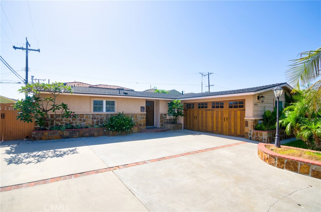 Welcome to 8757 Los Altos Drive — a well-maintained single-story pool home nestled in a peaceful Buena Park neighborhood. This inviting 4-bedroom, 3-bathroom home offers 1,633 square feet of comfortable living space on a generous 6,324 square foot lot. The home was extensively remodeled by the previous owners in 2018, featuring an updated kitchen with sleek quartz countertops, modern cabinetry, and stylish finishes. All three bathrooms were also tastefully renovated at that time. Additional improvements included LED recessed lighting, energy-efficient double-pane windows, and custom landscaping. Since purchasing the home, the current owners have replaced all flooring with attractive, durable laminate throughout. The layout includes a separate laundry room and a bonus area that's perfect for a home office or study space. The living room features a cozy fireplace, and the open flow of the floor plan makes it great for everyday living and entertaining alike. Step outside to enjoy your private backyard oasis — complete with a fenced pool and spa, covered patio ideal for gatherings, and a serene fish pond. The front yard adds excellent curb appeal with its professional landscaping, and the attached two-car garage features a custom door. Situated in the well-regarded Anaheim Union High School District, this home is zoned for Kennedy High School and offers testing eligibility for the prestigious Oxford Academy. Convenient access to local shopping, dining, and freeways makes this an ideal location for commuters and families alike. Don’t miss the chance to make this move-in ready, thoughtfully upgraded home your own. Schedule your private showing today!