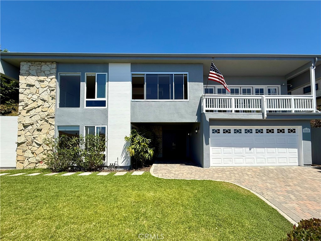 Located in the Top of the World neighborhood of Laguna Beach, this three bedroom, two bathroom home offers panoramic coastline and Catalina Island views. The property includes a spacious front yard with grass, an upstairs deck, and a private backyard with a patio. The interior features a functional floor plan with abundant natural light, and the two car garage provides direct access to the home. The location is within close proximity to Top of the World Elementary, Alta Laguna Park, and nearby hiking and biking trails. This home combines indoor comfort with outdoor space in one of Laguna Beach’s most desirable neighborhoods.