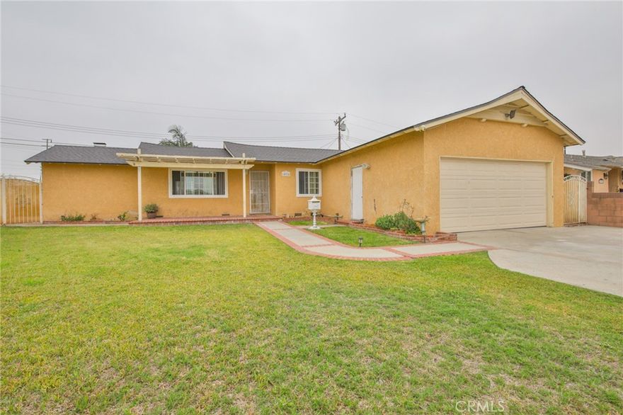 Beautifully remodeled Home is located on a quiet cul-de-sac. This residence features three bedrooms and two bathrooms. Highlights include a brand-new bathroom, a new roof, and a spacious 2-car garage. Enjoy year-round comfort with central heating and air conditioning. The remodeled kitchen boasts modern finishes, a brand-new stove, and a range hood. The home features wood flooring throughout, along with a spacious family room ideal for entertainment and a cozy fireplace. Additionally, this home is conveniently located near shopping centers.