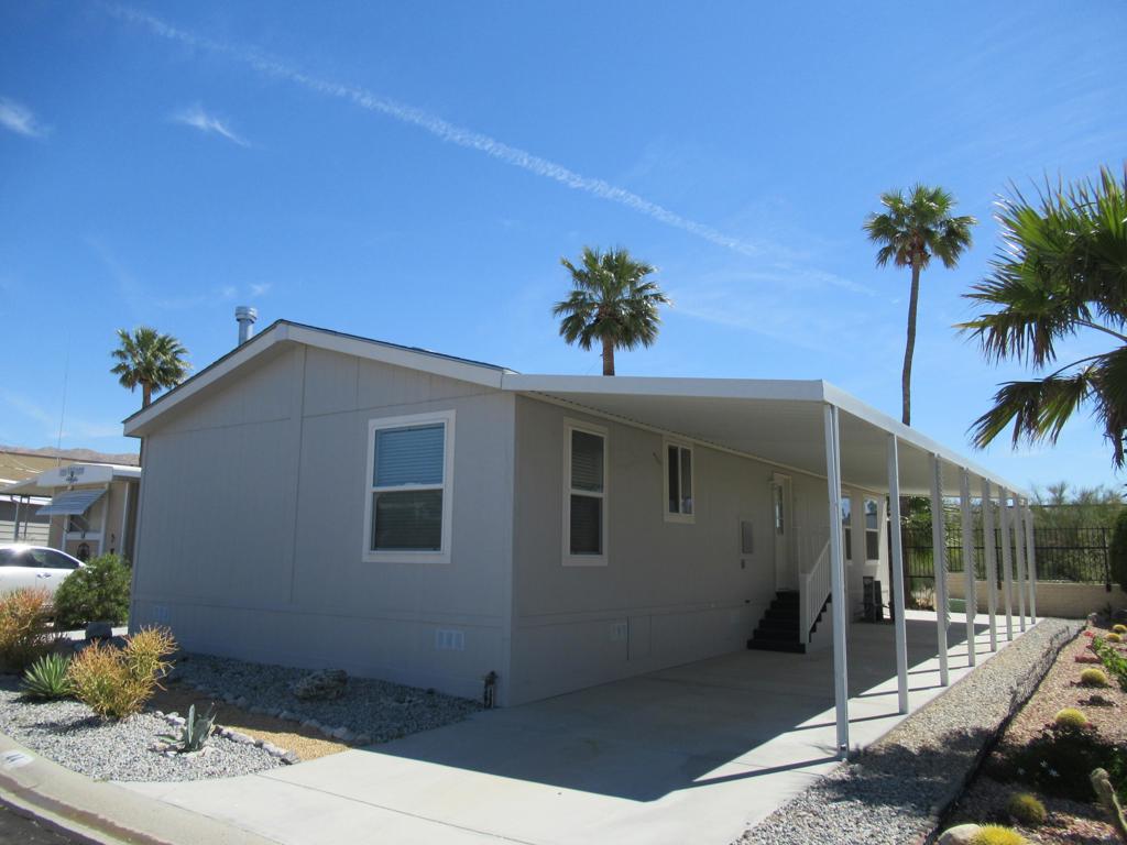2021 Champion model in the 55+ gated community of Skys Haven. Open floor plan with 2 spacious bedrooms, 2 full bathrooms, Carpet and wood laminate flooring throughout the unit. Kitchen equipped with Whirlpool appliances, granite countertops, and plenty of storage space. Ceiling fans in every room along with a fireplace in the living room. Desert landscaping for easy maintenance. The community features a clubhouse, swimming pool, and spa. Close to Palm Springs, shopping, dining and entertainment.