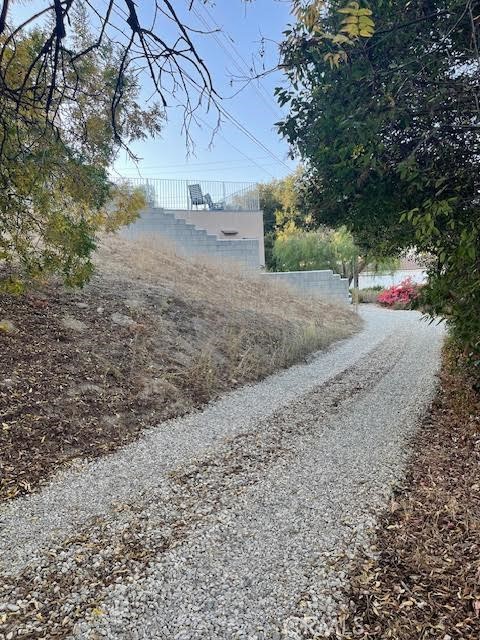Woodland Hills Lot for sale & investment purchase opportunity south of the Boulevard! This property is well located on a hillside and at the end of a paved road overlooking all of Warner Center, Woodland Hills and beyond throughout the San Fernando Valley. The views from this property make this a worthy drive to see this property in person and to explore building your dream home. This lot is also located adjacent to Woodland Hills Country Club & walking distance to Serena Park while being very close in proximity to Malibu and the beaches over the hill. This location is minutes from the Topanga mall and the 101 freeways which also will make this location commuter friendly while offering a tranquil and quiet location & setting for your peace of mind. This property value and building possibilities are truly ideal for any and all who have been looking to create a custom home for a life of quality living enjoyment within this popular and highly desirable community! Come and see for yourself...........