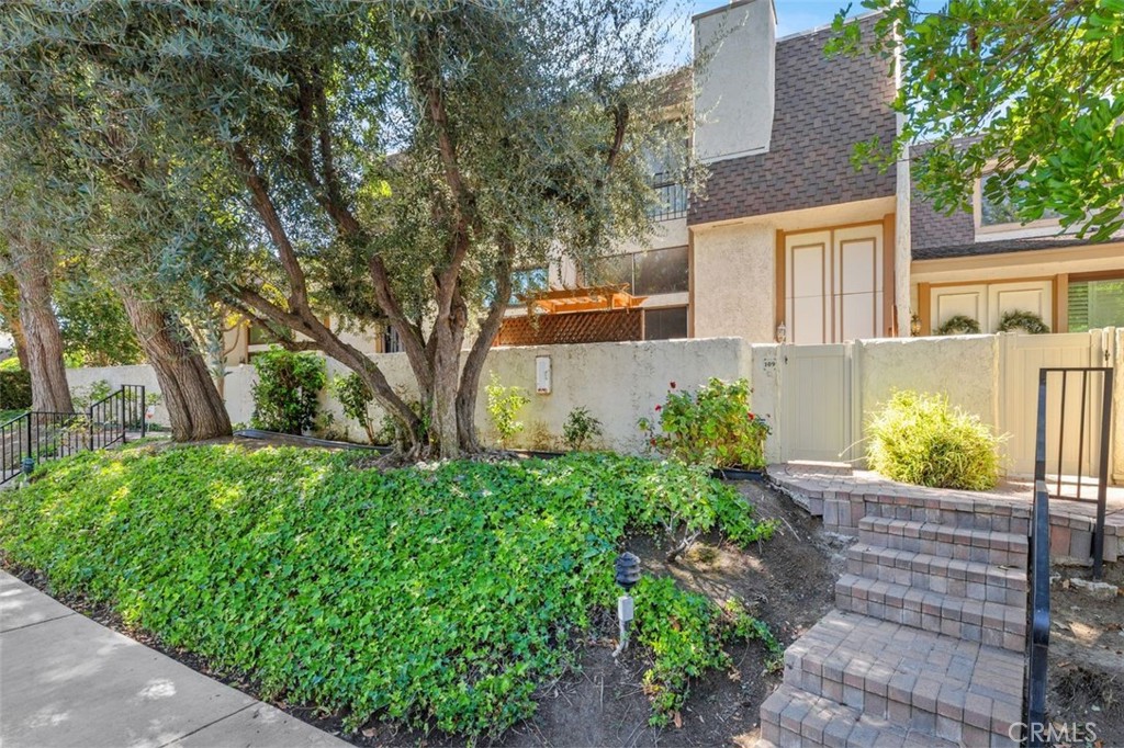 Welcome to 6225 Shoup Avenue, Unit #109, a beautifully appointed condominium in the heart of Woodland Hills, nestled within the sought-after Dove Creek community. This spacious 3-bedroom, 2.5-bath residence offers approximately 1,764 square feet of light-filled living space with an inviting open-concept layout. Enter through the private front gate into a charming patio retreat, perfect for relaxing or entertaining. Step inside to a sunken living room featuring a cozy gas fireplace and sliding glass doors that lead directly to the patio, creating a seamless indoor-outdoor flow. Just up the stairs, the dining area opens to a luminous kitchen complete with a large breakfast bar and all the appliances you need. The primary suite is a true sanctuary with a walk-in closet, a full bath featuring a shower/tub combo, and an expansive vanity with generous storage. Two additional well-sized bedrooms offer flexibility for guests, home office, or hobbies. The home also includes a private two-car garage and access to resort-style amenities including a sparkling pool, relaxing spas, tennis courts, and beautifully manicured grounds. Experience comfort, convenience, and community in one of Woodland Hills’ most desirable neighborhoods.