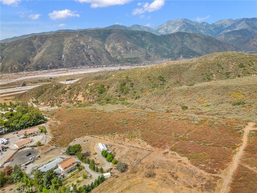 Take advantage of this rare opportunity to own 3.79 acres of prime land at the end of a quiet cul-de-sac in Devore, an unincorporated area in San Bernardino County. This secluded parcel offers breathtaking views, privacy, and endless possibilities for your dream home. The adjacent 5.55 acre parcel is for sale as well providing an opportunity to own 9 acres. Nestled among custom-built homes, this is the perfect spot to create a private retreat while still enjoying convenient access to modern amenities. Experience country living without sacrificing convenience—just minutes from Victoria Gardens, the Summit, and major freeways for effortless commuting, shopping, and entertainment. Whether you envision a luxurious estate, a peaceful getaway, or an investment opportunity, this expansive lot is a blank canvas ready for your vision.