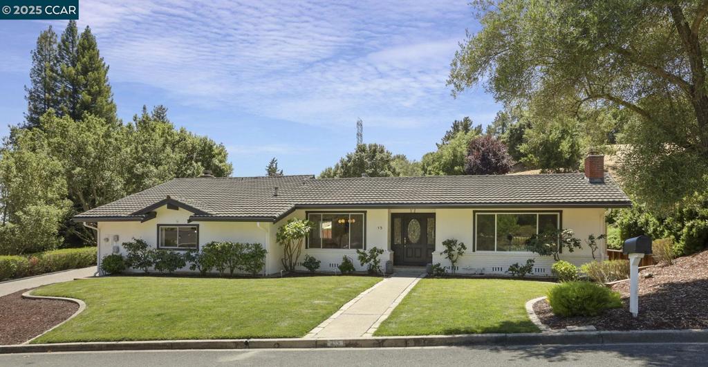 It's rare to find an expansive, level, beautifully landscaped, sun draped property with a pool and sport/pickle ball court in Moraga. Walk into a fresh, modern single level 4 bedroom 2.5 bath home that's flooded with natural light. The updated open plan kitchen with quartz counter seating is open to a breakfast nook & great room with a sleek bar area. There's a chic laundry room and 1/2 bath right off this area with convenient access to the fully finished, clean garage with epoxy flooring. All bathrooms are recently updated with access off the hall bath to the outside pool area so no wet kids running through the house. The primary suite has access to the gorgeous back yard through a large sliding door, a walk-in closet + 2nd closet, dual vanity w/ separate shower/toilet room. Updates include hardwood floors, solid core doors and hardware throughout, recess and designer lighting, and separate living & dining rooms to entertain. The fully fenced backyard has a large lawn, planting beds, room for a veggie garden and plenty of room to entertain family, friends and guests. Fantastic Los Perales Elementary is just down the street. Proximity to a Country Club, Farmer's Market, Moraga Commons Park, an off leash dog park, hiking Trails and Moraga Shopping Center. Top rated K-12 schools.