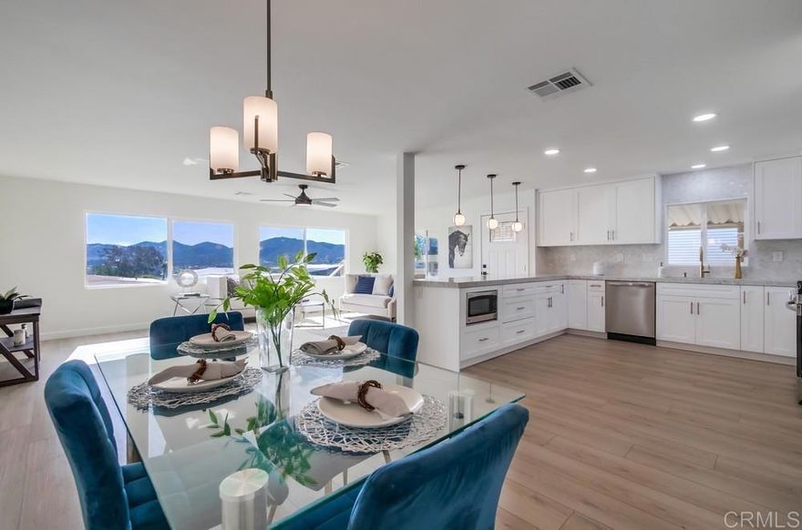REMODELED, VIEW property located in a 55+ resort style community w/ rent control.  This home offers an open floorplan where the inspiring panoramic views can be enjoyed from the Living room, Dining room, and Kitchen, as well as from the private custom deck!  All new gourmet Kitchen featuring quartz counters, shaker cabinets, recessed lighting, full tile backsplash, a vent hood over the stove, new stainless steel appliances, a single basin stainless steel sink, and a spacious dining bar that makes a statement!  Both Bathrooms have been remodeled and the Primary Bathroom features dual sinks, an extra vanity, and a huge custom shower with dual shower heads!  New roof, new drywall interior, refinished ceilings, vinyl dual pane windows, luxury vinyl floors throughout, all new interior doors & fixtures, lever door handles, rocker light switches, and more!  The Central A/C and furnace are newer and have been recently serviced.   3 brand new ceiling fans to circulate the great breezes!  The exterior boasts easy to maintain turf and a storage shed.  The treck deck wraps around the home and features a built in bench and bar top!  There is also a private covered patio that runs along the other side of the home.  Watch the 4th of July fireworks from your own home!  Rancho Vallecitos is a beautiful, 5-Star, resort style community for persons 55 years of age and over (2nd resident can be age 45+). One of the most beautiful manufactured home communities in California, Rancho Vallecitos has great views that can be enjoyed throughout the community, plus many social activities and amenities. Amenities include a clubhouse/recreation building, pool & spa, library, gym, billiards room, card tables, game and craft room, putting green, dog park, RV parking for an additional cost, and so much more! Monthly space rent is $698.31 and park is under city rent control.