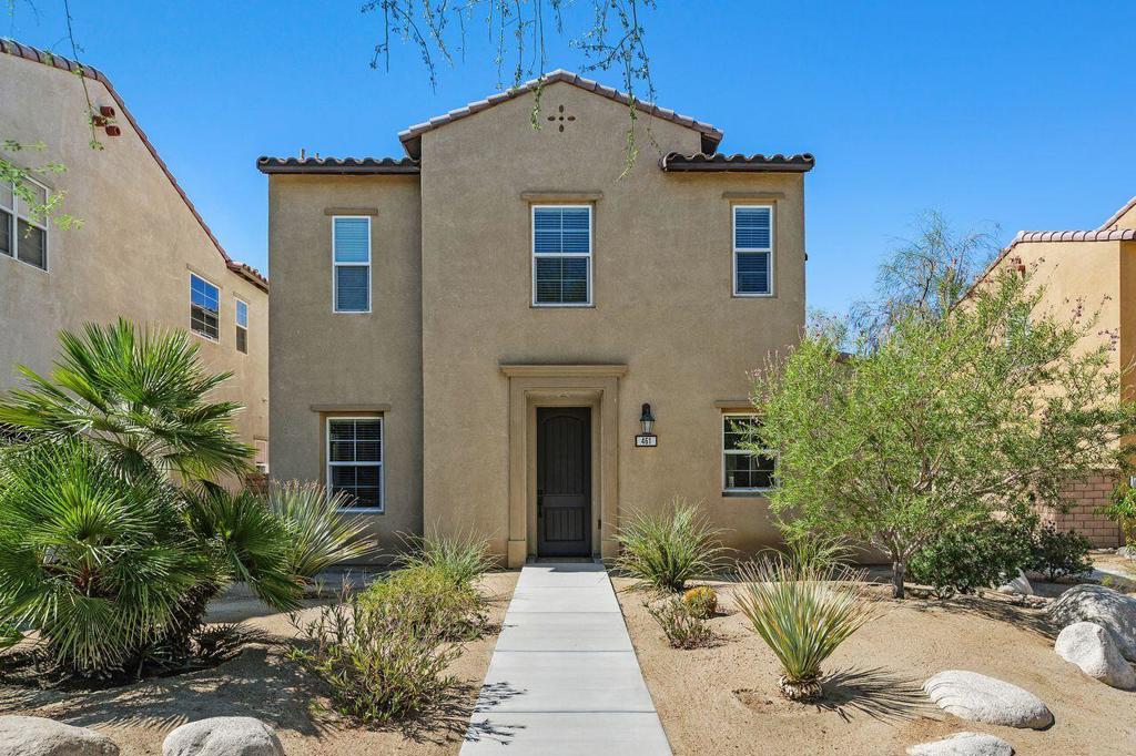Located on the premier street of the charming Spanish Walk community sits an exceptional residence with a unique opportunity to own the largest model with refined features rarely available in the neighborhood. The first level is stylish and welcoming with warm, engineered hardwood floors, glass French doors into a flex room with an adjacent full bathroom, enhanced fireplace with flanking built in cabinets and a large, paver courtyard directly off the living area. A magnificent kitchen with huge center island is comprised of elevated, white granite countertops flecked with chocolate ribbon and paired with a complementing backsplash offset by the dark, rich cabinetry with strategically placed glass-faced cabinet doors. Beautiful open banister staircase leads to a split floor plan with an elegant primary suite set apart from two additional bedrooms and a shared dual-sink bathroom. The primary suite bathroom with contiguous walk-in closet showcases sleek tile floors, upgraded dual-sink vanity and a custom tiled shower and tub surround. The second floor also includes a convenient, large laundry room and a sizeable loft area with built-in cabinets. Thoughtfully designed storage solutions are found throughout the home, including the rare 3-car garage for customized needs! The gated, well-manicured, amenity rich community of Spanish Walk includes 3 pools and spas, fitness center, billiard room and green space for extended leisure, all with the added bonus of IID utility service and an excellent central Coachella Valley location. This special home is an extraordinary find in this outstanding community.