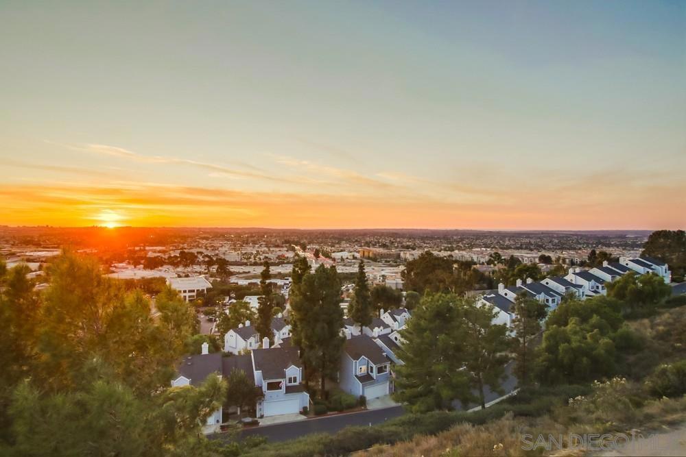 Breathtaking Panoramic Views Await! Revel in the splendor of nightly sunsets and city lights from the heart of Scripps Ranch in this charming yet modern condo. Boasting 2 bedrooms, 2 full baths, and 1402 square feet of thoughtfully designed living space, this residence offers both comfort and allure. Featuring 3 spacious balconies, strategically positioned to maximize the breathtaking westerly views and immerse yourself in the scenic surroundings. This impeccably maintained residence is ready for you to move in! It showcases vaulted ceilings and abundant windows that flood the space with natural light. The living room, adorned with a warm fireplace and attractive laminate flooring, creates a welcoming ambiance perfect for relaxation and gatherings. The kitchen is a culinary haven, featuring ample cabinet space and a generously sized dining area. A unique bonus awaits—a loft area with its own balcony, offering versatility as an ideal office space or media area. The primary bedroom is a true private retreat, complete with an exclusive balcony, walk-in closet featuring custom cabinetry, and an upgraded bathroom with stunning custom tile work in the shower. Designed to infuse the home with plenty of natural light, creating an inviting and airy atmosphere, this condo also includes the convenience of a two-car attached garage. Nestled in a gated community on a hill, the residence provides both security and gated access. Trails allow residents to hike down to Lake Miramar, a community pool to play in, and minutes from Trader Joe's, Restaurants, freeways and more!