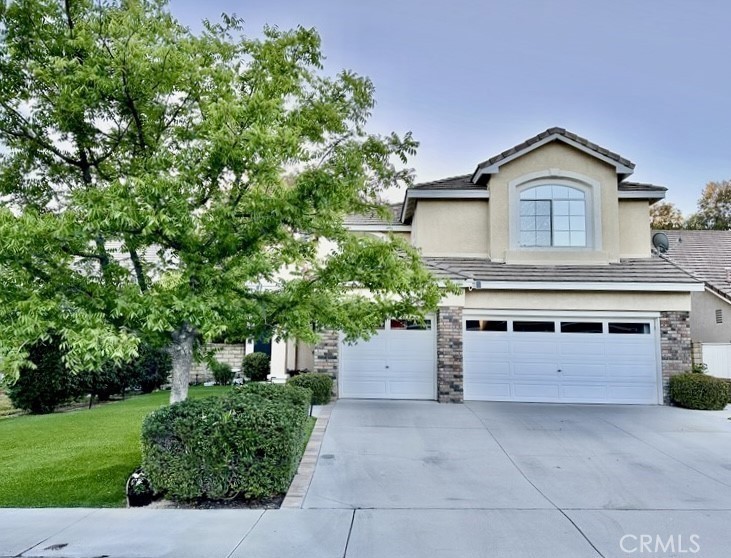 Welcome home to this beautiful 4-bedroom Northbridge house! It has its very own pickleball court, 8-holes of putting golf and NBA size basketball hoop! Just minutes away from the award winning Helmers elementary school and the amazing Northbridge community park, pools, tennis courts, basketball court, clubhouse and walking trails. Almost every bit of the house was remodeled over the last few years. Upon entry, you will find high vaulted ceilings in the spacious living and dining rooms and plantation shutters throughout the home. All the flooring was replaced in the last two years, including large wood-like tile downstairs and real wood upstairs. The stunning upgrades in the kitchen include a custom backsplash, quartz countertops, and all stainless-steel Kitchen Aid appliances with a professional 6-burner cooktop stove. All bathrooms were remodeled with cabinets, quartz countertops and new faucets. Open kitchen to family room concept with plenty of windows, allowing for tons of light. The windows have top-notch solar screens to keep out the heat during the hot summers. There is also a whole house fan that helps cool the house at night. Full bedroom/office downstairs and a bathroom with a shower. Spacious primary suite with a huge walk-in closet! This lovely home also has a newer Lennox HVAC system, which includes a top-of-the-line purification system and thermostat. There is an attached 3-car garage with an abundance of built-in storage cabinets. The backyard has the same expensive wood-like tile as the house and is the perfect entertainer's yard. LOW HOA & NO MELLO ROOS TAX! TURN KEY HOME! Hurry! Won't last!