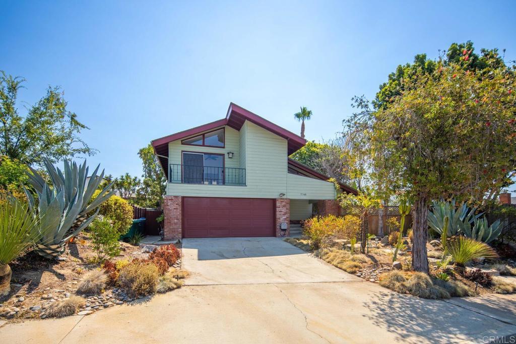 This spacious 4-bedroom, 2.5-bath home is located on a quiet street on a 9,061 sq. ft. level lot. The home offers expansive living areas drenched in natural light. The main living room greets you with two-story ceilings, plank flooring, and ample space. Beyond the living room, you step down to a formal dining room, kitchen, and family room. The dining room features a custom chandelier by Luciano with Murano glass and offers views of the lush exterior. The kitchen is well-appointed with stainless steel appliances, affords views of the lush backyard, and awaits your personal touches. It adjoins the spacious family room, which is anchored by a large fireplace and has two large sliding doors leading to the backyard. The first floor also includes a convenient half bath, a bedroom, and access to the laundry area and 2 car garage. The expansive backyard is lushly landscaped with a custom rock wall defining the stone and concrete patio, offering endless possibilities for relaxing and entertaining. The primary suite on the second story offers high ceilings, a deck perfect for your morning coffee, an ensuite bathroom with dual vanities, a large walk-in closet, and a decorative ceiling fan. There are two additional bedrooms with walk-in closets and ample storage cabinets rounding out the top floor. The attached oversized two-car garage includes built-in storage shelving and access to the side yard. La Costa is renowned as a luxury coastal destination, conveniently located minutes from the Pacific Ocean, and offers a myriad of shopping, dining, and entertainment options.