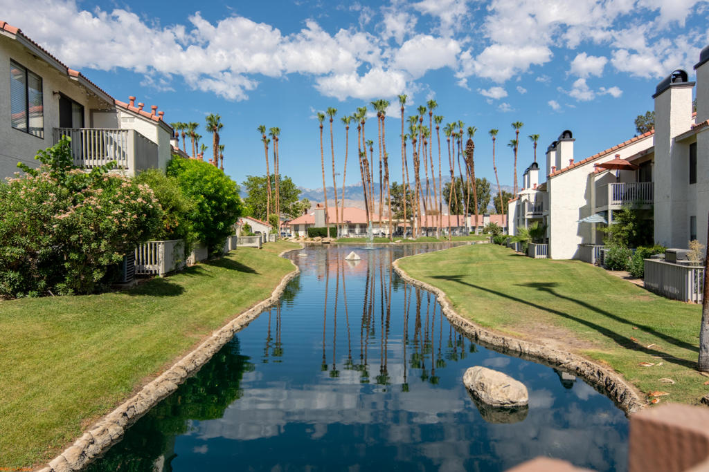 One of the best values in Palm Desert! This move in ready 2 bedroom, 1 bath home is filled with natural light, featuring an open-concept living and dining area that flows seamlessly into the kitchen. The kitchen includes ample cabinet space which leads one out to the private patio with tranquil pond views The unit also offers in unit laundry for everyday convenience and an assigned covered parking space just steps away. Whether you're looking for a full-time residence, a seasonal escape, or an investment property with strong rental potential, this home checks all the boxes. Palm Lake offers resort-style amenities including two pools and spas, tennis and volleyball courts, a fitness center, clubhouse, and more--all just minutes from world-class shopping, dining, and entertainment on El Paseo, Palm Desert Charter Middle School & Palm Desert High School.