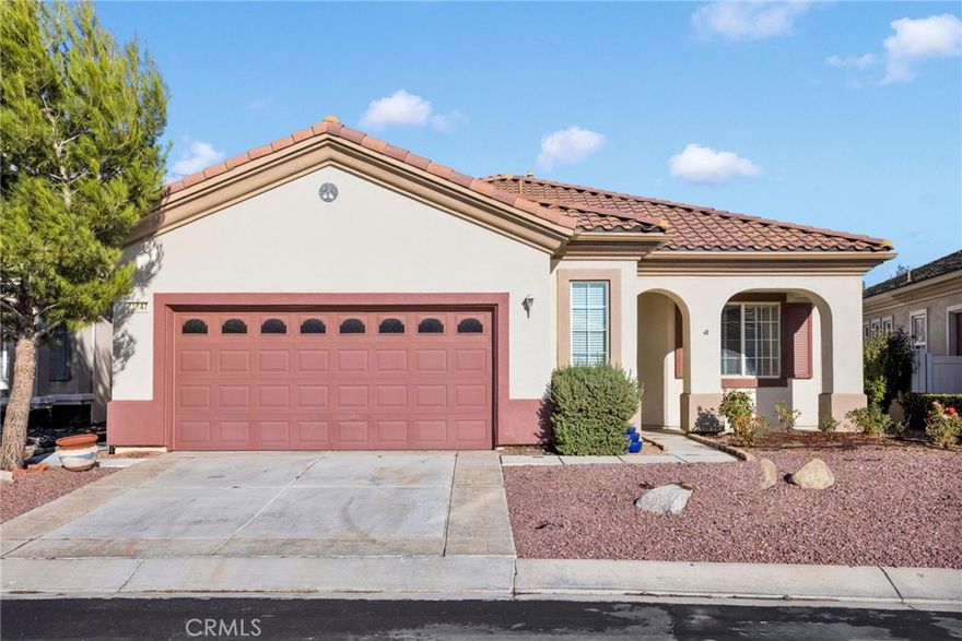 Welcome to the highly sought after 55+ community of Solera at Jess Ranch.  This home features an open concept kitchen, eating area and living room with natural light,  high ceilings and a cozy fireplace.  As you relax in your living room, you can see the beautiful Ashwood Golf Course through the full wall sliding glass doors.  As you step outside, you have a lovely covered and wind protected patio.  The low maintenance yard features a fountain, nectarine tree, roses and more plants.  Inside, you will find the guest room near the front door.  There is a large walk in closet and direct access to the main bathroom with its own door.  Down the hall, you will see the bonus room with double doors that makes a great office or den.  At the end of the hall is the master suite with an expansive walk in closet with a lot of space for storage.  The master bath has a spa like feel with double sinks, a soaking tub and a separate glass shower.  As you move toward the garage, you find the laundry room (washer & dryer not included).  The two car garage has a space to the side for a golf cart or storage.  

The community is gated with 24 hour roaming security.  There are many activities within the community offering the opportunity for an active lifestyle or making new friends.  The clubhouses and property offer pools (indoor & outdoor), spa, tennis, pickleball, bocce ball, fitness center, walking trails, library, table tennis, and more.  

Ample shopping is nearby with Jess Ranch Marketplace just around the corner featuring Target, Best Buy, Staples, movie theaters, restaurants & more.  This area is expanding rapidly.  

Whether you are looking for quiet solitude or a place to be active and meet people, you will find it here!