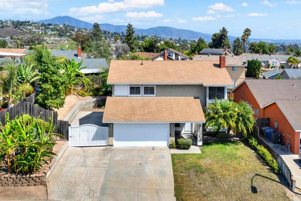 Perfect home for your family or multifamily. Spacious home w/5 bedrooms, 2 1/2 Baths. Open living rm w/fireplace connects to large dining rm. Kitchen/granite counters, ss sink w/lge window looks into backyard. Granite counter section faces family rm. Perfect for entertaining or eating casually. Family rm slider opens to the private backyard w/sm patio, grass & unique varieties of trees incl. 2 peach, 1 guava,1 pomegranate,1 dragon fruit,2 types of banana trees & 1 fig tree. Bedrooms are good size, 1 has double dr entry, primary has lge closet and Bath. New carpet. Oversize 2 car garage. Gated side yard has many options. Newer 3-year-old roof. Newer water heater. Close to shopping, schools and freeways. Move in ready.