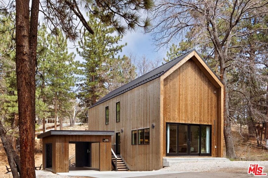 Designed for escape, built for financial performance. House of Bear is more than a home, it's a performing asset, consistently booked year-round with strong summer and holiday demand offering verified revenue. Crafted for both lifestyle and return, this Scandinavian-inspired retreat proposes the rare chance to own a luxury residence that functions as a turnkey business from day one. A seamless blend of minimalist design and organic warmth, this newly built architectural showcases natural materials, raw travertine and calacatta viola marble, plaster walls, 30-foot ceilings, and expansive windows framing the surrounding mountains. Every detail invites calm and connection from the chef's kitchen and plush living spaces to the private deck and outdoor jacuzzi beneath the stars. Just minutes from Big Bear Lake, ski resorts, and downtown's charming restaurants and shops, this home was designed to harmonize luxury with nature while maximizing income potential in one of Southern California's most desirable mountain destinations. Purchase includes a fully established short-term rental business with transferable rental platforms, branded Instagram account, and website delivering a seamless transition for future owners and instant cash flow upon acquisition. Delivered fully furnished with EV charger.