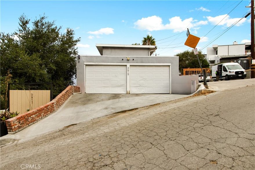Perched in the coveted hills of Studio City, this South of the Boulevard, two-bedroom, one-bath duplex offers both charm and convenience in one of the city’s most desirable neighborhoods. A private entrance opens to a charming balcony with sweeping valley views, the perfect backdrop for morning coffee or evening sunsets. Inside, you find an open-concept living room, where warm wood floors create an inviting atmosphere. The kitchen is thoughtfully appointed with generous counter space, abundant cabinetry, a dishwasher, a refrigerator with built-in ice maker, and more. Down the hallway, the bathroom features a spacious walk-in shower, and a convenient washer/dryer with folding station. Both bedrooms offer comfort and storage, with the primary suite boasting double closets, a linen closet, and ample space for a king-size bed. Additional highlights include both window and mini split AC units, two designated parking spots plus additional guest parking. Nestled minutes from the esteemed Harvard-Westlake School and Studio City’s best dining and lifestyle amenities, this home is a seamless blend of privacy, comfort, and quintessential California living.
