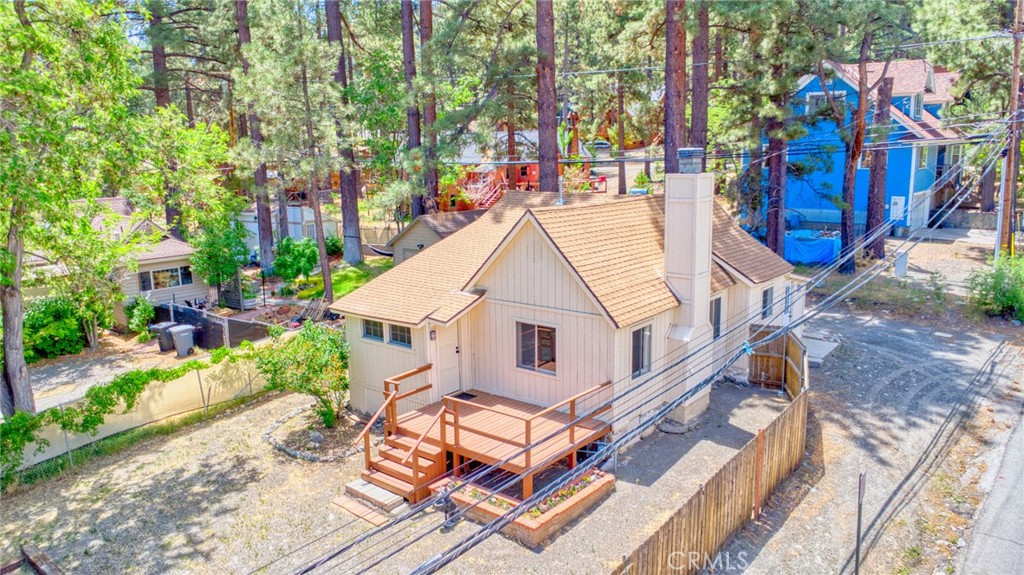 Charming Mountain Retreat in the Heart of Wrightwood
Nestled in the scenic heart of Wrightwood, this beautiful mountain retreat perfectly blends comfort, convenience, and small-town charm. Situated on a prime corner lot, the property is bathed in natural sunlight and offers generous parking— including ample space for RVs.
One of the home’s standout features is a large detached two-car garage, ideal for protecting your vehicles from the snow or providing additional storage space. Inside, you’ll enjoy year-round comfort with central heating and air conditioning— a true luxury in Wrightwood. Cozy up in winter by the inviting wood-burning fireplace and rest easy knowing the home has been thoughtfully updated with new flooring, an upgraded electrical panel, a new water heater, toilet, vanity, ducting, and window screens.
The layout includes a versatile bonus room that can be used as a home office or an extra bedroom, plus a convenient outdoor storage shed.
Location is everything—this home is directly across from the elementary school and just one block from Wrightwood’s charming village, filled with local shops, restaurants, and cozy coffee spots. For outdoor lovers, it’s a dream come true: just minutes from Mountain High Resort and surrounded by hiking trails and year-round adventures in the Angeles National Forest.
Don’t miss your chance to own a slice of Wrightwood’s peaceful mountain lifestyle. Schedule your private showing today!