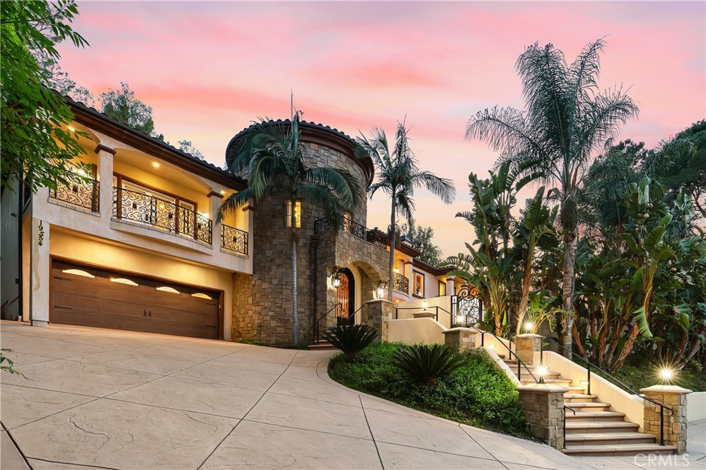 Discover your private Mediterranean paradise estate in the prestigious south of the Blvd, set behind gates and surrounded by lush greenery, palm tree, spacious long driveway and crafted with exquisite iron gates, embodies seclusion and elegance. Built in 2010, this custom home boasts premium materials and thoughtful design, offering panoramic valley views and dazzling swimming pool and Jacuzzi. Entering into a magnificent 25 ft tower adorned with Venetian Plaster, magnificent banisters, travertine and wood flooring. The first floor includes two master suites, a full bar, wine room/humidor, DUMBWAITER and convenient laundry facilities with a LAUNDRYSHUTE. Outside, an expansive entertainer’s patio features a pool, spa, Viking BBQ, fire pit, and a 6 CAR TANDEM CAR GARAGE.
The gourmet kitchen dazzles with custom cabinetry, granite countertops, Viking appliances, a large center island with garden views. The luxurious master retreat features its own fireplace, dual walk-in closets and spa-style bath, Brazilian cherry wood flooring, a granite fireplace, wet-bar, romantic balcony, Carrera marble floors, and his-and-her walk-in closets. Additional suites offer plush baths, carpeting, and custom closets. Peaceful and perfectly located, this home provides an ideal escape from the everyday. Don't miss the opportunity to make this Tarzana gem your own. Schedule your private tour today and experience the epitome of PRIVACY LIVING at its finest. No expense was spared on this truly breathtaking estate! Available for a short-term lease. Owner will consider short term lease, film studio use, photo shoot use or a long-term lease. It offers plenty of room for large unforgettable family & friend gatherings, large special events…. Neighborhood attractions include El Caballero Country Club, High end Golf courses, Marvin Braude Mulholland Gateway Park, hiking trails, Ventura Blvd, boutiques, cafes, supermarkets, freeways and the Best Shops & Entertainment! Don’t miss this amazing opportunity. This home is fully furnished with new furniture. Price without furniture, if furniture needed call agent for pricing. THIS HOME IS FOR SALE OFF MARKET