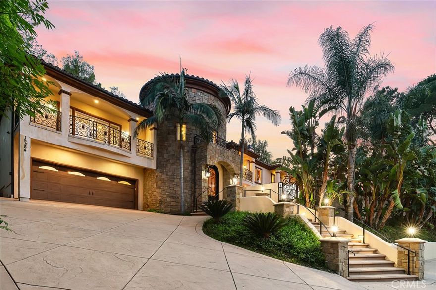 Discover your private Mediterranean paradise estate in the prestigious south of the Blvd, set behind gates and surrounded by lush greenery, palm trees, spacious long driveway and crafted with exquisite iron gates, embodies seclusion and elegance. Built in 2010, this custom home boasts premium materials and thoughtful design, offering panoramic valley views and dazzling swimming pool and Jacuzzi. Entering into a magnificent 25 ft tower adorned with Venetian Plaster, magnificent banisters, travertine and wood flooring. The first floor includes two master suites, a full bar, wine room/humidor, dumb waiter and convenient laundry facilities with a LAUNDRYSHUTE. Outside, an expansive entertainer’s patio features a pool, spa, Viking BBQ, fire pit, and a 6 CAR TANDEM CAR GARAGE.
The gourmet kitchen dazzles with custom cabinetry, granite countertops, Viking appliances, a large center island with garden views.  The luxurious master retreat features its own fireplace, dual walk-in closets and spa-style bath, Brazilian cherry wood flooring, a granite fireplace, wet-bar, romantic balcony, Carrera marble floors, and his-and-her walk-in closets. Additional suites offer plush baths, carpeting, and custom closets. Peaceful and perfectly located, this home provides an ideal escape from the everyday. Don't miss the opportunity to make this Tarzana gem your own. Schedule your private tour today and experience the epitome of PRIVACY LIVING at its finest. No expense was spared on this truly breathtaking estate! Owner will consider short term lease, film studio use, photo shoot use or a long-term lease.  It offers plenty of room for large unforgettable family & friend gatherings, large special events…. Neighborhood attractions include El Caballero Country Club, High end Golf courses, Marvin Braude Mulholland Gateway Park, hiking trails, Ventura Blvd, boutiques, cafes, supermarkets, freeways and the Best Shops & Entertainment! Don’t miss this amazing opportunity. This home is fully furnished with new furniture. Price without furniture, if furniture needed call agent for pricing. THIS HOME IS AVAILABLE FOR SALE OFF MARKET.