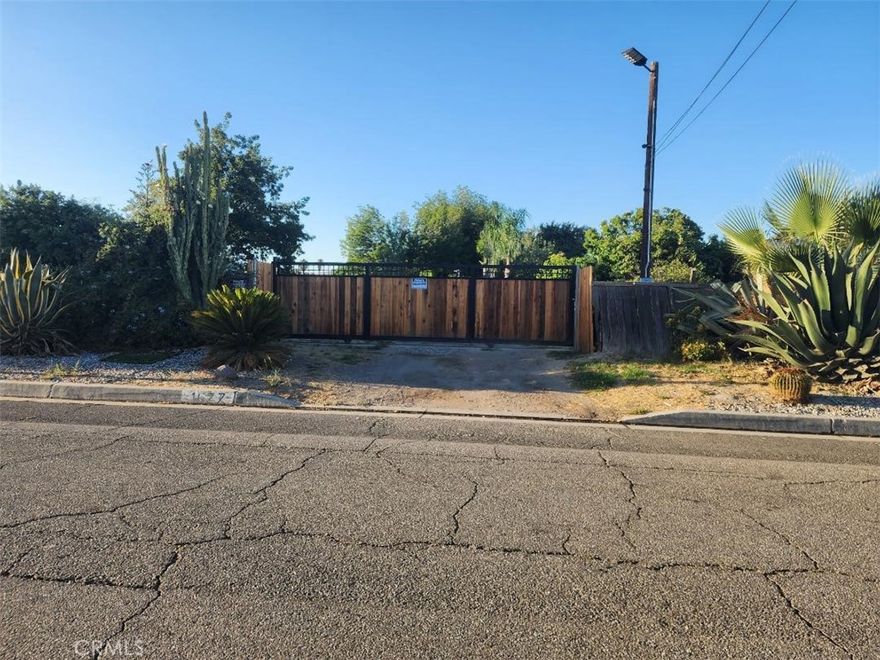 Discover the potential of this expansive vacant lot located on a quiet, well-established street.  Measuring approximately 27,000 square feet, this generously sized parcel offers a rare opportunity for custom construction, investment development or long-term holding.  Surrounded by various homes and mature trees, the lot which is completely fenced boasts privacy in a peaceful neighborhood setting while maintaining close proximity to schools, parks, shopping, and public transportation.  With utilities readily available at the street, zoning that supports residential use and possible seller financing, this blank canvas is ready for your vision.  Whether you're a builder, investor, or future homeowner, this is a prime location with endless possibilities