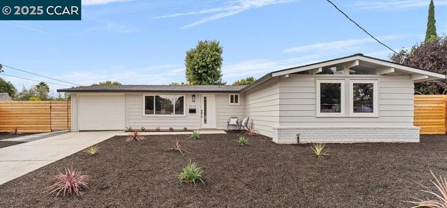 Fall in love with modern living in this fully renovated midcentury home, where every detail invites comfort and style! Nestled in a peaceful court, this stunning home features four spacious bedrooms, two bathrooms, and a permitted addition, offering 1,574 sq ft of beautifully designed, open-concept living. High vaulted ceilings and dual-paned windows fill the space with natural light, while a new modern kitchen - complete with quartz countertops, custom cabinetry, and stainless steel appliances - anchors the heart of the home. The large dining area has room for the whole family - whether it’s enjoying everyday meals or memorable holiday dinners. With a brand new roof, fresh paint, smooth walls, durable LVP flooring, recessed lighting & remodeled bathrooms with contemporary vanities, peace of mind is assured.  Elegant French doors open to an expansive backyard with new concrete patios, a high privacy fence, and a huge lot — perfect for entertaining, gardening, or ADU potential. The lot provides a long driveway, RV/boat access, and a garage for ample parking, while the location offers easy access to major freeways and BART, making commuting a breeze. With its prime location, thoughtful design, & incredible features, it’s the perfect place to begin your new chapter!