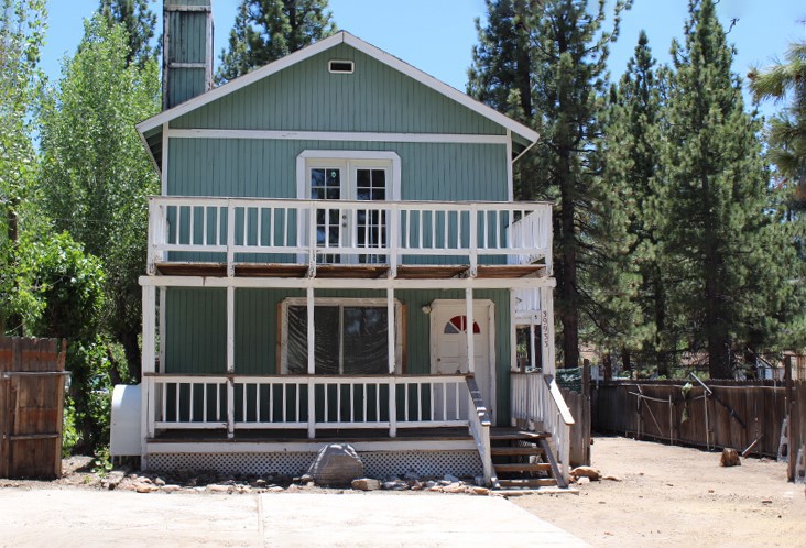 Fixer special! Bring your offer on this fixer. Must be a cash sale, but nice location on a quiet road walking distance to Holloways Marina. Big house for the money with 3 bedrooms (one has a fireplace), 2 baths and large great room. Fenced yard and two decks. Tons of potential