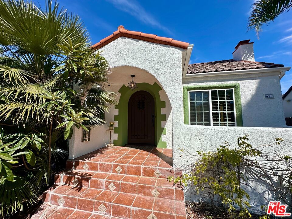 From the first steps into this Spanish Revival estate, you'll feel the difference from all other properties. Blended authentic charm with mid century modern convenience. You will adore the original beauty of Old Hollywood, lavish bathtubs and surrounding vintage tile, inviting gourmet kitchen and numerous outdoor patios designed for hosting guests and family in the green backyard under the shade of mature trees. The wooden roof top deck welcomes you to enjoy the tranquillity and star viewing at night. Recently remodeled from top to bottom the house has kept a lot of the original rare to find fixtures. Warmth and coziness are the main treasures of this home. The estate consists of the main house with 3 bedrooms and 3 bathrooms approximately 1800 square feet along with permitted 560 square feet separate structure with CofO and could be used as a guest quarter, office, playroom or possible ADU. Located in the heart of Melrose Promenade and tucked away enough to feel peace and quietness after a busy day. The property is within walking distance to a myriad of shopping, restaurants, parks and museums nearby and in proximity to The Grove, Beverly Centre etc.