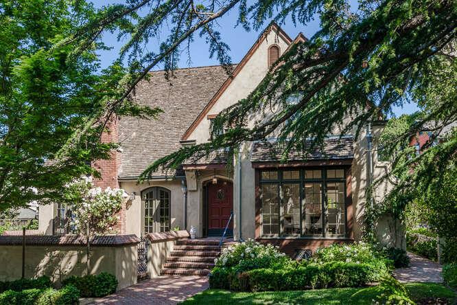 Thoughtfully designed & tastefully appointed, this home showcases the finest of finishes & designer touches throughout. From the herringbone-patterned brick pathway, driveway & front courtyard to the exquisite millwork & decorative leaded glass windows, classic details have been restored & newer elements of the highest quality meticulously curated to create a luxurious living experience. Gracious front entry with majestic door, leaded side lites & stunning spiral staircase. Elegant, light-filled living room: high ceilings, handsome fireplace & French doors Exquisite dining room with beautiful windows. Chef's Kitchen: 2 Sub Zeros, 2 islands, 2 dishwashers, 2 sinks, 6-burner Wolf range with griddle & 2 ovens, Viking warming drawer, pot filler, limestone floors, soapstone & marble counters; butler's pantry with loads of cabinetry Stylish office with custom cabinetry Family room: stately fireplace & built-in bench & cabinetry with French doors to back limestone patio. Primary Suite: Walk-in closet, deep tub, dual sinks Outdoor Oasis: Saltwater pool, lush gardens, built-in Green Egg (BBQ & smoker) & gas fire pit. Pool house: Full bath, kitchen, loft, built-in desks & outdoor shower Plus: 3 car garage; laundry room upstairs, workshop/potting shed, WAP Network & built-in speakers.