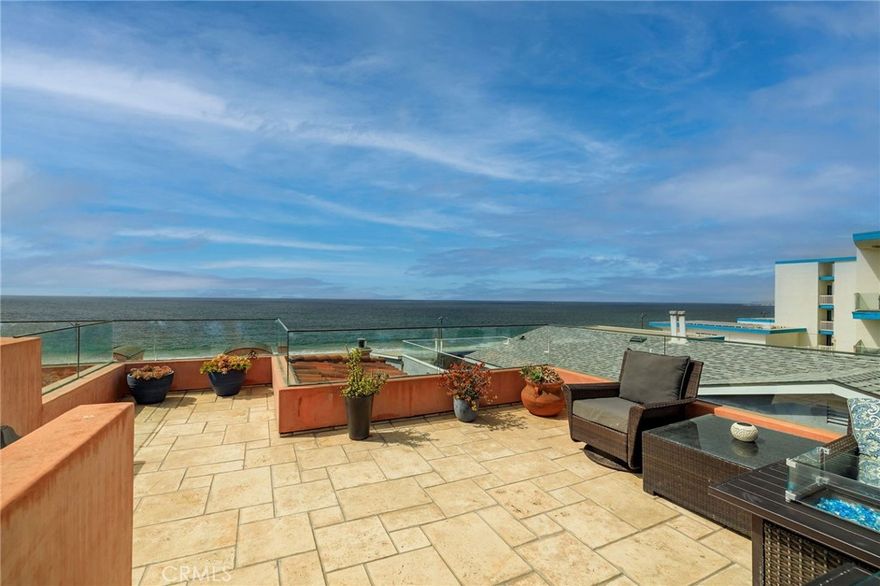 Set along the Esplanade, the ultimate address in Redondo Beach, this exceptional home combines the serenity of ocean views from the living space with the vibrancy of Riviera Village just moments away. A thoughtfully designed layout balances sophistication and privacy, beginning at the entry where the two car garage connects directly to the home along with a bedroom and full bath that can serve as a guest suite, home office, or private retreat. Continuing upstairs, the second level offers another bedroom with high ceilings, its own full bath, and a walk-in closet. The hallway leads to your expansive primary suite. Facing west, this tranquil sanctuary captures the sound of the ocean and features three closets including a walk-in. The ensuite bath is spa-inspired, finished in neutral stone with dual vanities, a soaking tub, and a separate shower. On the top floor, the main living area is highlighted by beautiful ocean views and natural lighting through large windows, with an open concept design that seamlessly connects the living and dining rooms to a chef’s kitchen, complete with a center island and bar seating. Granite countertops, Viking stainless steel appliances, abundant custom cabinetry, and a wine fridge are ideal for preparing meals, entertaining guests, or simply enjoying the good life at the coast. The dining area opens to a wraparound balcony bringing in ocean breezes, more views, and extending the indoor-outdoor flow. Crowning the residence is your spacious rooftop deck with true 360-degree vistas, the Pacific and coastline to the west, Palos Verdes hills to the south, the Redondo Pier to the north, and palm trees peppered with lights when looking into town. From morning coffee to sunset gatherings and nights under the stars, this is a setting that elevates every occasion. Beyond the home, the lifestyle is equally compelling. Step outside to the sand across the street, or head a couple of blocks to Riviera Village with its charming boutiques, sidewalk cafés, and vibrant dining scene. Enjoy the ocean air, take a yoga class on Catalina Avenue, ride your bike along the path, pick up groceries at Trader Joe’s or the Farmers Market, and meet friends at local eateries, all within minutes of your front door. Situated in the award-winning Redondo Beach Unified School District, this prestigious home combines coastal surroundings with refined living in a close-knit community.