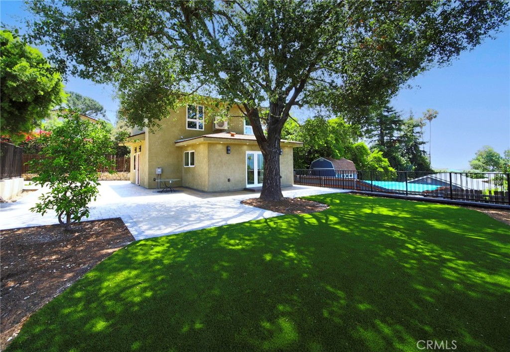 Reduction! Brand new gorgeous modern house built to perfection on a large lot situated high above Foothill in a desirable neighborhood. The house is located within walking distance to Two Strike Park, and the distinguished Blue Ribbon Schools add value to this property. The gorgeous contemporary home features 2 bedrooms, 2 bathrooms, and a Den or Office. The cheerful sun-filled living room dining room combo is exquisite, with an elegant electric fireplace, many built-in cabinets, and the room opens to a beautiful backyard with mature trees and patio, room for sitting, dining, or just enjoying outdoors and looking at majestic mountains. The den and 2nd bathroom are conveniently located on the 1st floor and can be used as an office or guest bedroom. The 2 bedrooms and one bathroom on the 2nd floor features mountain views, high ceilings, wood floors,and stylish built-in cabinets and drawers. The open concept gourmet kitchen with an island and all brand-name appliances is the highlight of this home and makes cooking and entertaining easy and fun. Some of the other special features are elegant laminated floors throughout, recessed lighting, LED lights, it provides all of the appliances including the washer & dryer, and each room has an individual air and heat split system ( save utilities by cooling or heating one room only if desired), a large storage space, a smart remote for turning on and off the air & heat, double pane doors and windows long driveway with plenty of parking space and many more.... This one-of-a-kind home is a back-house which offers ultimate privacy with its large yard, wide and long driveway, and all brand-new amenities for today's California-style modern life!