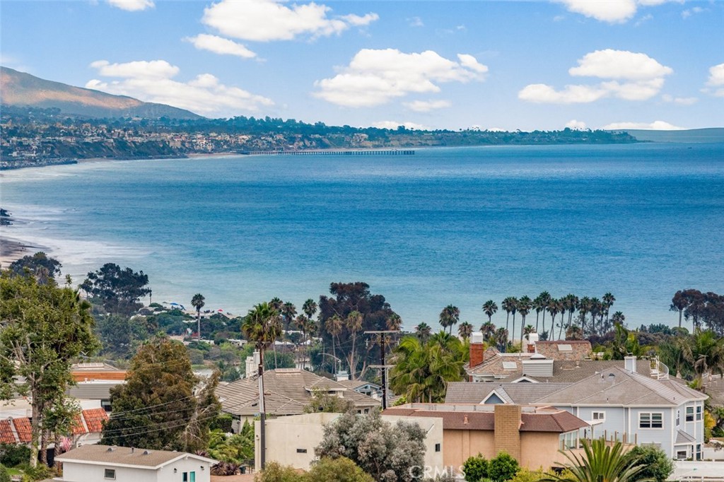 A Hidden Jewel with Breathtaking Views from Every Level! Perched in the heart of Dana Point’s coveted Lantern Village, this newly remodeled coastal sanctuary offers an exceptional blend of timeless elegance and contemporary luxury. With approximately 6,146 square feet of open living space, this 5 bedroom, 6 bathroom residence is a rare find. From the moment you step inside, you're greeted with panoramic whitewater ocean views that span across all levels. The expansive main floor features an open-concept layout with consistent designer flooring throughout, a wraparound deck perfect for entertaining, and a gourmet kitchen outfitted with state-of-the-art Thermador appliances, a wine bar, and endless ocean vistas. With soaring ceilings, clean lines, and walls bathed in natural light, this home is also the perfect canvas to showcase an art collection or create your own private gallery. The upper level includes a private-entry flex space ideal for an office, guest suite, or artist’s studio. An elevator provides effortless access to each floor, and the 3 car garage, ample storage, outdoor grassy area, and outdoor shower add to the home’s livability and appeal. This architectural gem radiates California chic with modern flair, neutral tones, sleek finishes, and thoughtfully designed outdoor areas that embrace the coastal surroundings. Located moments from the revitalized Dana Point Harbor, world-class dining, boutique shopping, and scenic beaches, this stunning home is truly a must see. Indulge in the ultimate coastal lifestyle, where luxury meets tranquility and creativity finds its home.