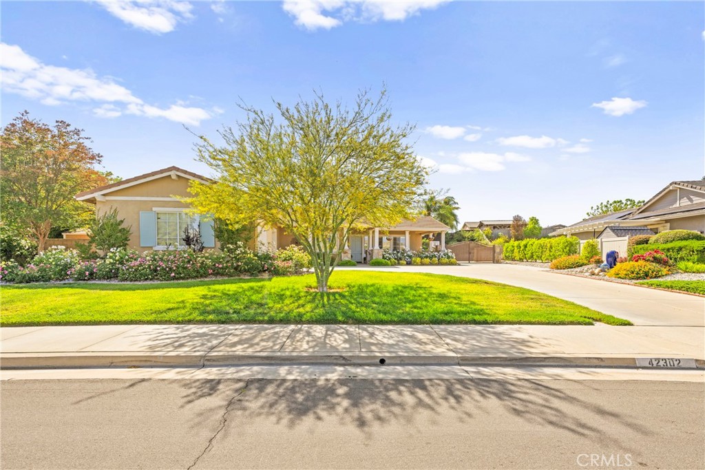 Welcome to this rare and exceptional single-level home nestled in the prestigious Murrieta Ranchos—a community known for its spacious single-story residences on oversized lots, complete with RV parking and stunning upgrades, situated on nearly .40 acres, this beautifully enhanced property offers a rare blend of luxury, functionality, and prime location. This highly desired layout features 4 generously sized bedrooms, 3 bathrooms, and a versatile office space that could easily serve as a 5th bedroom. With 2,766 square feet of well-designed living space, you’ll find thoughtful upgrades throughout, including rich wood-style vinyl flooring, plantation shutters, elegant crown molding, and enhanced recessed lighting. The chef-inspired kitchen showcases custom cabinetry, a granite countertops, stylish tile backsplash, and a premium Thermador range with custom vent hood—perfect for entertaining or everyday cooking. Car enthusiasts and adventurers will love the expanded 3-car garage, complete with an additional 10 feet of space ideal for a workshop, motorcycles, or that extra weekend ride. The property also features gated RV parking—wide enough to accommodate both an RV and a boat—as well as a separate 80 ft x 14 ft side yard for more storage or toys. Major recent upgrades include two newer 4-ton HVAC and FAU Systems, all-newer ductwork, and updated attic insulation, ensuring year-round comfort and energy efficiency. Step outside into a private backyard retreat with professional hardscaping, a tranquil cascading water feature, cozy firepit, and newly refreshed landscaping. Enjoy peaceful views of the Santa Rosa Plateau and plenty of patio space perfect for outdoor dining or gathering with friends and family. Located on Murrieta’s sought-after west side, this home is within walking distance to top-rated middle and high schools, parks, and scenic trails all with no HOA fees and low property taxes.