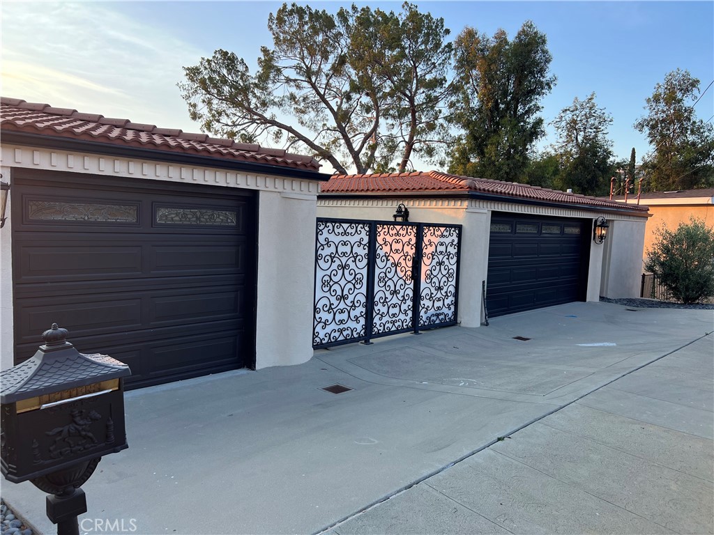 Partially remodeled 5 bedroom house with 4 full bathrooms . On the main floor you will find open concept remodeled kitchen with open area to the living room, formal dining room, and formal living room. Kitchen has been newly remodeled with high end heat resistant quartz countertop with beautiful detail resembling porcelain. Main level has two bedrooms with two full baths . As you go downstairs, you will find the primary suite bedroom which is oversized with a nice size his in her sink bathroom with a very large over 500 ft.² his and her walk-in closet . Additionally, downstairs, you will find two more bedrooms with a Jack and Jill full bath room, and a 6 th room that can be movie theatre , office, gym . 4 of the 5 bedrooms have walk in closets . This house sits on over 30,000 ft.² of land that can be turned into a private personal resort retreat ( owners have plans that they can pass along to new owner ) or up to three additional dwellings can be built on the land below an addition to the two garages that can also be converted to ADU as well potentially allowing for five ADU’s total in the home. Back yard already has a pool ready to go that has recently been re painted . Priced to sell , this house has endless possibilities with the land it sits on . Home included new floors and recess light throughout the entire home . Home had washer and dryer on BOTH LEVELS . Sunsets in the backyard so the home gets light all day long including the afternoon. Dual ac system. Beautiful exterior with olive trees . 2 separate garages , 1 car garage on 1 side and 2 car garage on the other . Garage is equipped with 220 for electric vehicle charging