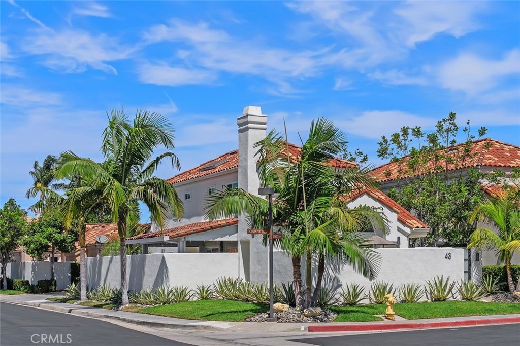 Completely remodeled and turnkey, this 3 bedroom, 2.5 bathroom, 1,601 sq. ft. home is located in the private gated community of Bayview Terrace. Set within a very private compound, the residence showcases custom paint, molding, floorboards, triple-pane windows, wood shutters, LED lighting, porcelain tile flooring throughout, and a stunning Quartzite stone fireplace. The gourmet kitchen features premium finishes, stainless steel appliances, and excellent flow for entertaining.
The primary suite includes new window shutters and LED lighting. The spa-inspired primary bath offers Quartzite counters, a full Quartzite slab shower with bench, Toto toilet, porcelain tile, built-in vanity with lighting, custom closet doors, and a cabinet above the vanity.
The secondary bedrooms are equally impressive, with new windows, wood shutters, mirrored closet doors, and porcelain tile flooring. One features a chandelier and a custom closet drawer setup, while the other offers a bright, open feel with updated finishes.
Additional highlights include hidden under-stair storage, internet readiness, newer water heater, custom landscaping, and unmatched curb appeal. Outdoor living is enhanced with porcelain hardscaping that matches the interior, an outdoor TV, and a private setting. The two-car garage is complete with epoxy floors, cabinets, and a new garage door opener.
Community amenities include pool, spa, and tennis courts. Conveniently located near Fashion Island, world-class beaches, scenic trails, and top-rated schools.
