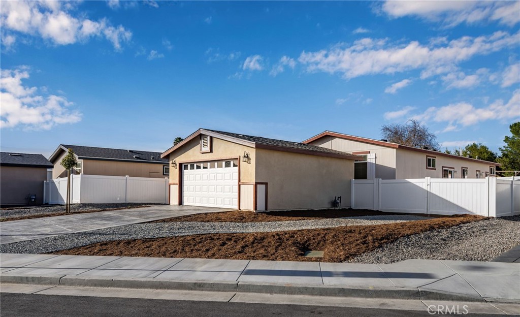 Welcome to our brand-new community offering stunning new homes designed with modern living in mind. Each home features spacious two-car garages, easily convertible to an ADU for added flexibility or extra living space. The expansive lots include front landscaping and are large enough to accommodate RV parking, perfect for all your outdoor needs. Inside, you'll find a beautiful open-concept floor plan with generous walk-in pantries and separate laundry rooms for ultimate convenience. Plus, enjoy the freedom of no HOA fees and no Mello Roos, making this the ideal place to call home. Homesite #5 Offers 3 bedrooms including an oversized primary and 2 full bathrooms. Call today to schedule your private viewing. Homes are on permanent foundation.