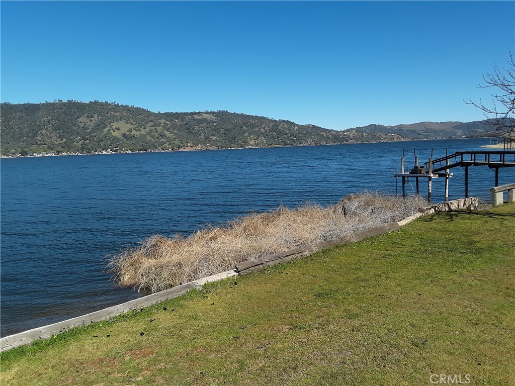 80 ft....Original Paradise Cove....A Hidden jewel of a location, Quiet and Peacefull ~~ away from the "vacationeers" only about 12 owner owned homes in this little enclave. ~~ Excellent seawall ~ steps to water ~ The "Original" plans---15 years ago!, Were to build a deck extending directly from your home patio doors straight out and over the lake with a ramp going directly down to your pier/boat ~~ This idea would not block your lake view! but allowing full access to the lake ~~ "Was" approved for an alternative septic system but the 2008 "Financial Fiasco" prevented any building @ that time.