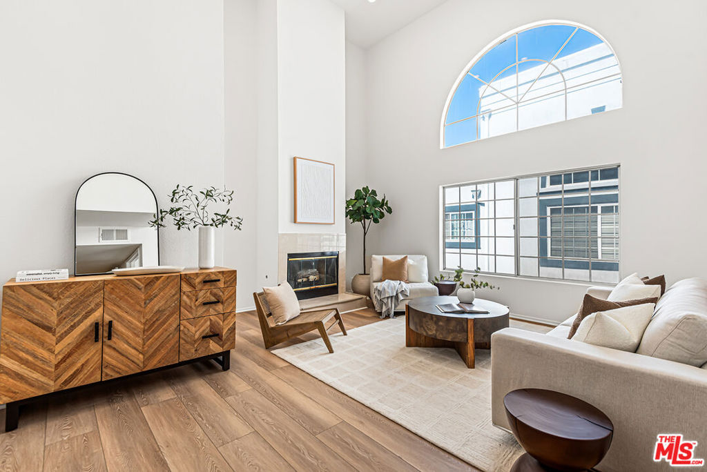 This spacious three-story townhome in the heart of Culver City offers soaring vaulted ceilings, a private rooftop deck, 3 bedrooms, 3 bathrooms, and a versatile loft. The home features brand-new luxury plank-style flooring throughout and an expansive living area with a gas fireplace and dramatic floor-to-ceiling windows, flooding the space with natural light. The updated kitchen is equipped with stainless steel appliances, granite countertops, and an adjacent dining area perfect for entertaining. The primary suite includes generous his-and-hers closets and a spa-like en-suite bathroom with Toto fixtures, a deep soaking tub, and dual vanity. Two additional well-sized bedrooms plus a loft ideal for a home office or creative space complete the floor plan. Additional highlights include central air and heat, in-unit laundry, two-car parking, low HOA's and exceptional storage with a large private walk-in closet room off your patio plus additional storage options in the garage. Ideally located across from a Culver City park, is within the highly regarded Culver City Unified School District (zoned for La Ballona Elementary with possible intra-district transfers, including Spanish and Japanese immersion programs, plus Culver City Middle and High School). You'll also find numerous private, charter, and religious schools nearby. Enjoy close proximity to shops, restaurants, downtown Culver City, Playa Vista, and Venice Beach making this the perfect home to experience the best of Westside living.